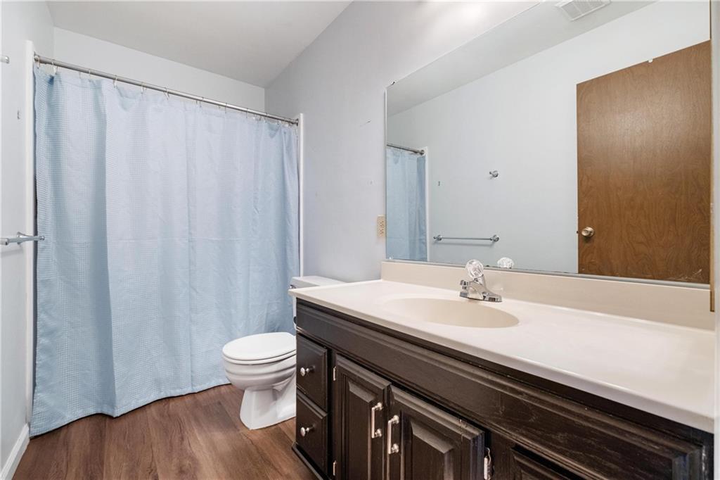 208 Countryside Drive McKees Rocks, PA 15136 - Photo 23 of 31 a bathroom with a sink a toilet and a mirror