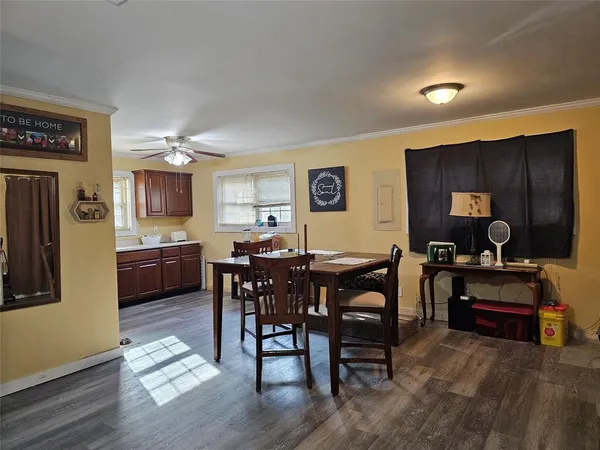 a view of a dining room with furniture and wooden floor