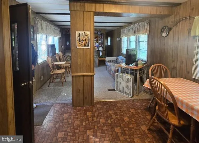 a view of a patio with table and chairs