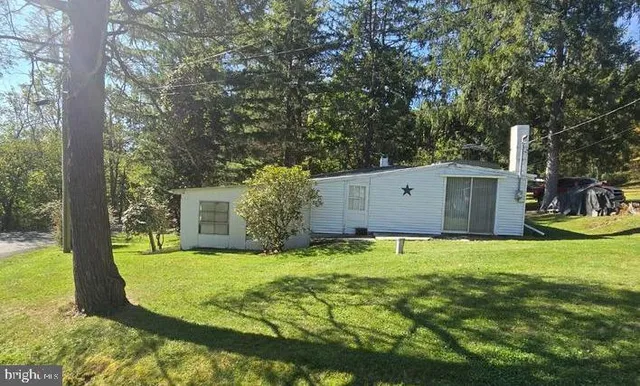 a view of a house with a big yard