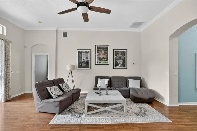 a living room with furniture and a rug