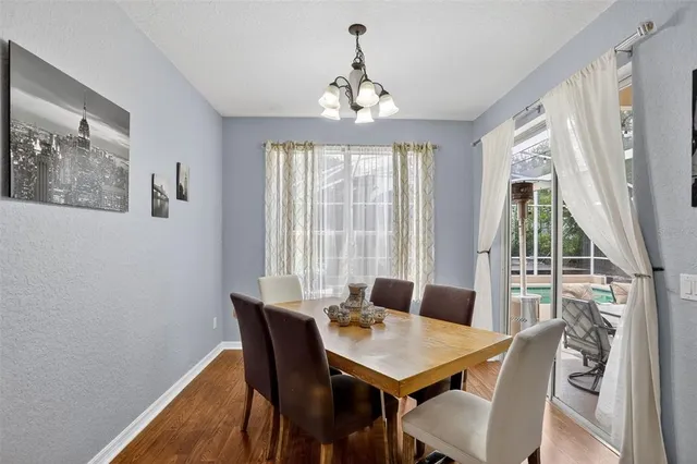 a view of a dining room with furniture window and outside view