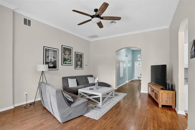a living room with furniture and a flat screen tv