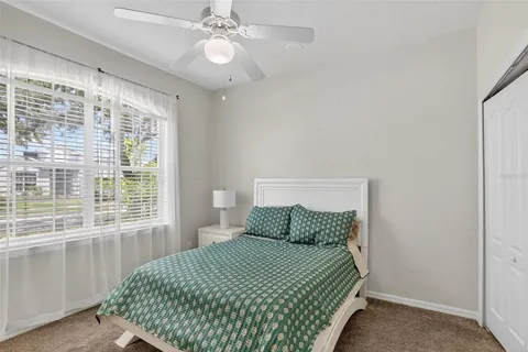 a view of an outdoor sitting area with furniture and floor to ceiling window