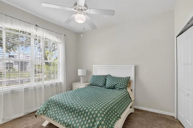 a view of an outdoor sitting area with furniture and floor to ceiling window