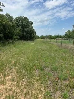 a view of a lake with houses in back