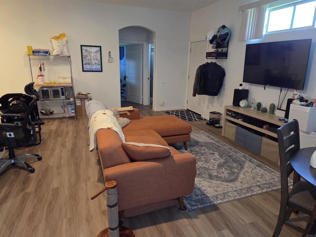 762 Grey Hawk Court Oceanside, CA 92057 - Photo 2 of 14 a living room with furniture and a flat screen tv