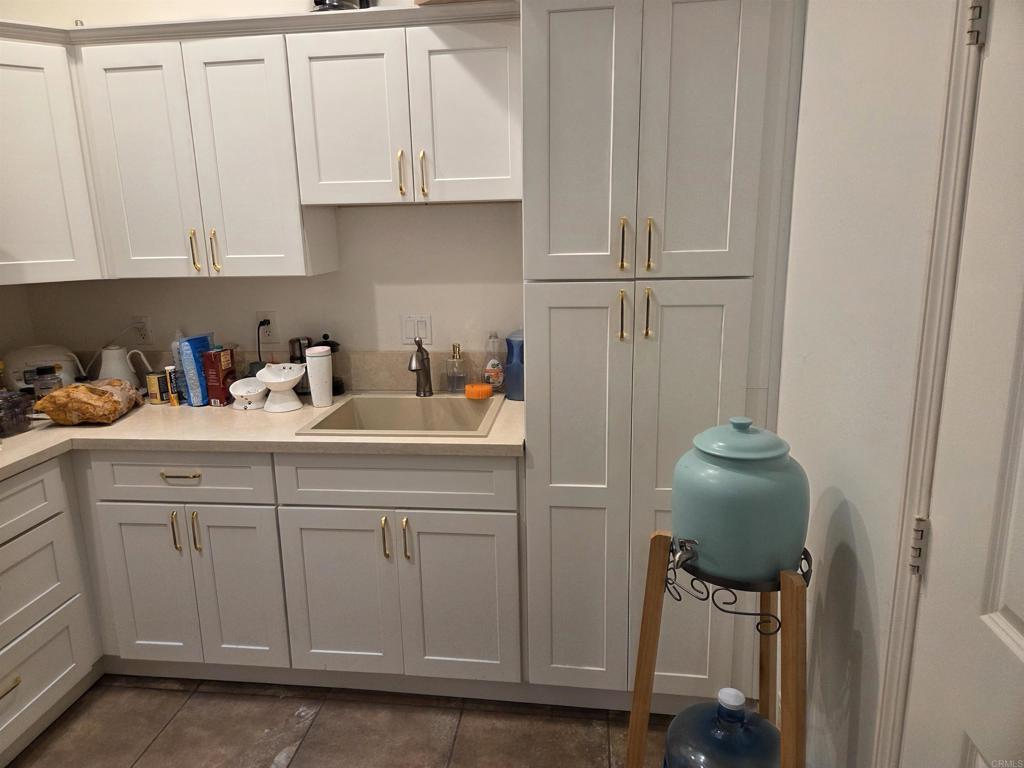 762 Grey Hawk Court Oceanside, CA 92057 - Photo 8 of 14 a kitchen with a sink cabinets and appliances