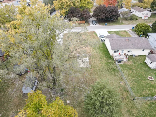 aerial view of a house with a yard