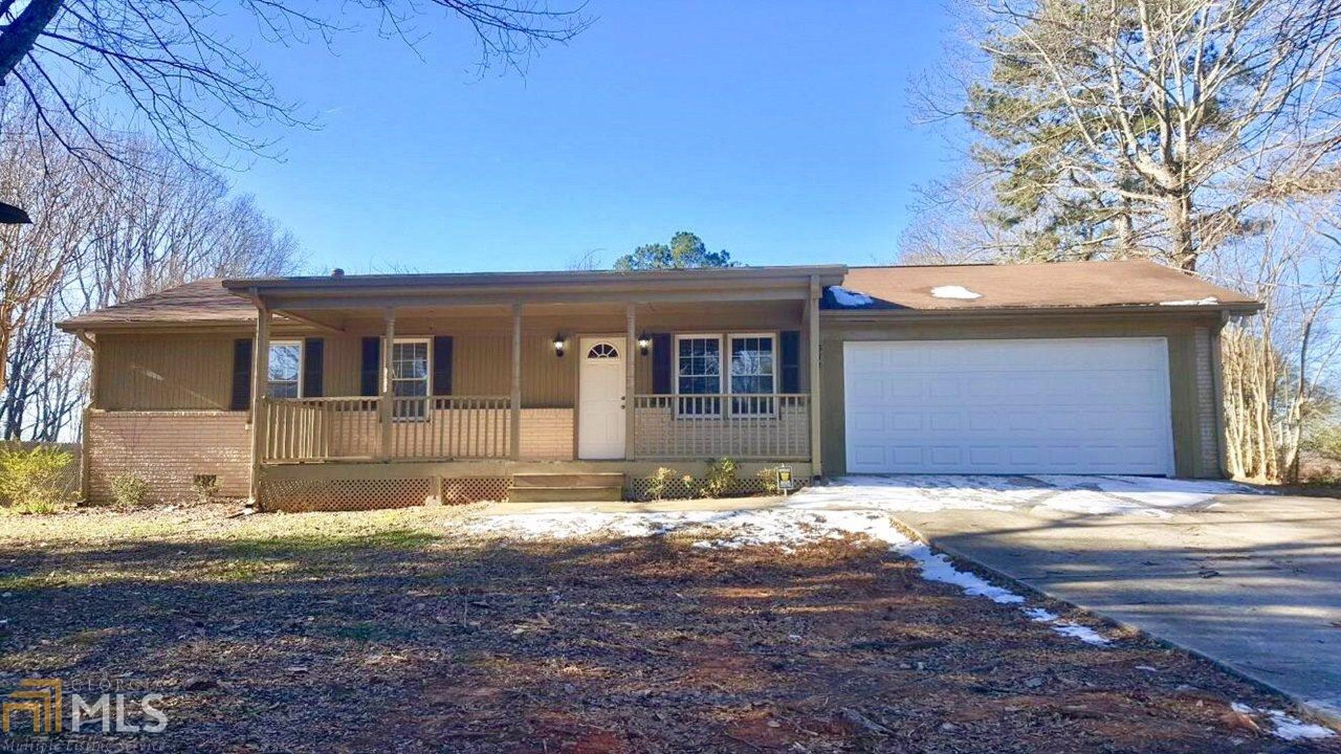 577 Tanner Road, Unit 2 Dacula, GA 30019 - Photo 1 of 1 a front view of a house with a yard