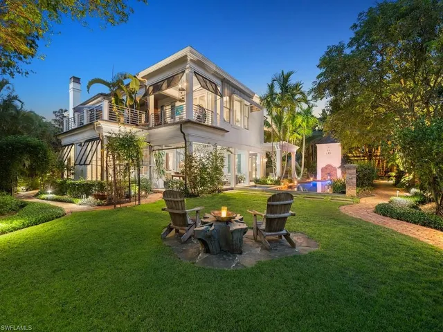 a view of a house with a yard porch and sitting area
