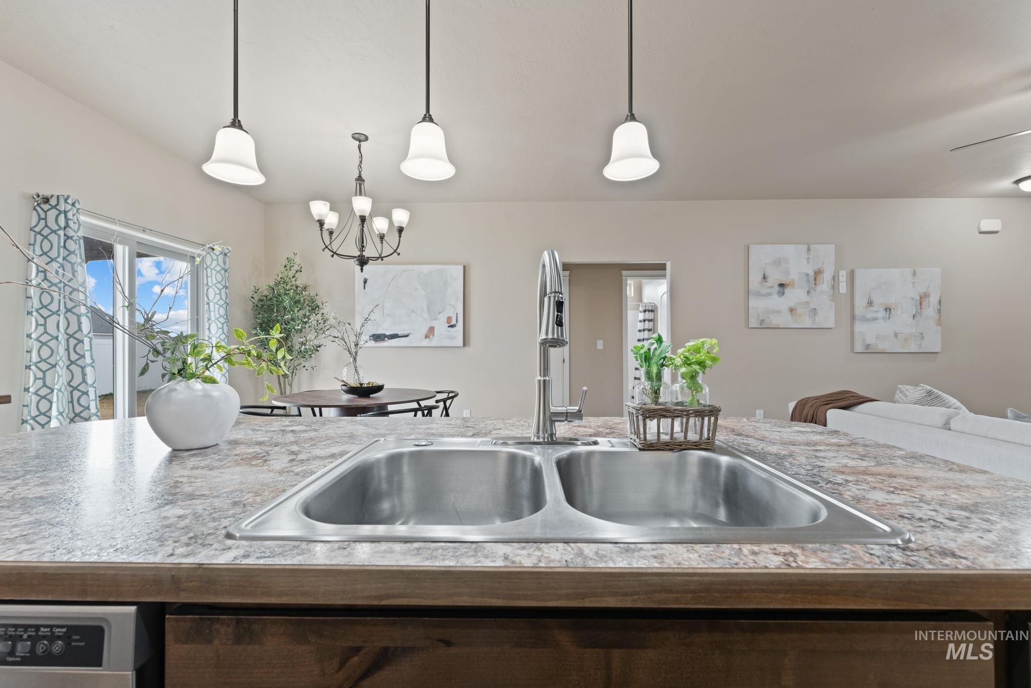 1001 13th Street Rupert, ID 83350 - Photo 39 of 40 Kitchen featuring light countertops, open floor plan, and hanging lights