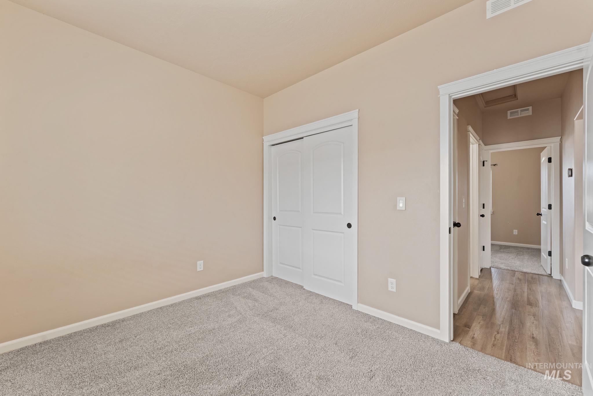 1001 13th Street Rupert, ID 83350 - Photo 25 of 40 Unfurnished bedroom with light colored carpet and a closet