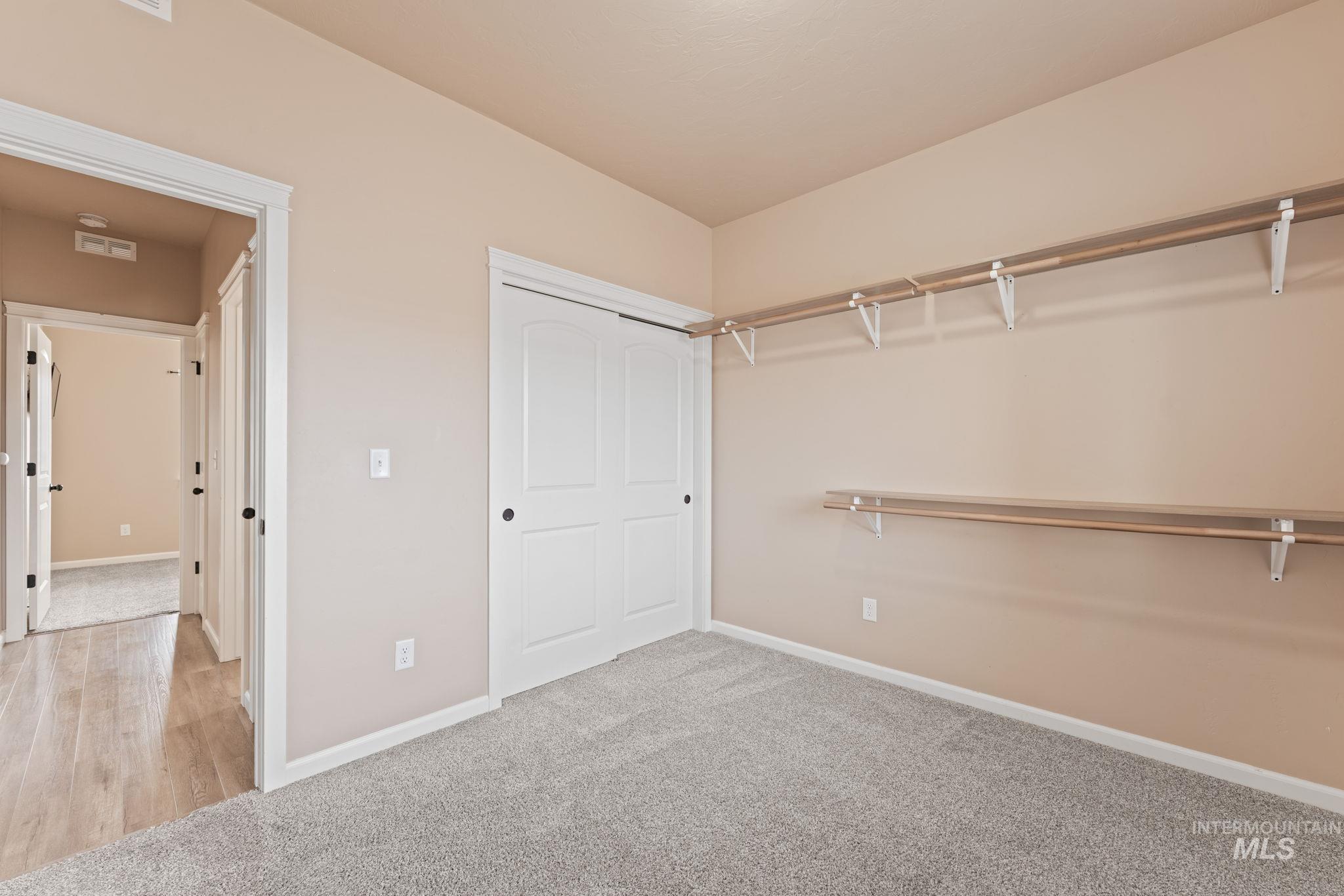 1001 13th Street Rupert, ID 83350 - Photo 29 of 40 Walk in closet featuring light colored carpet