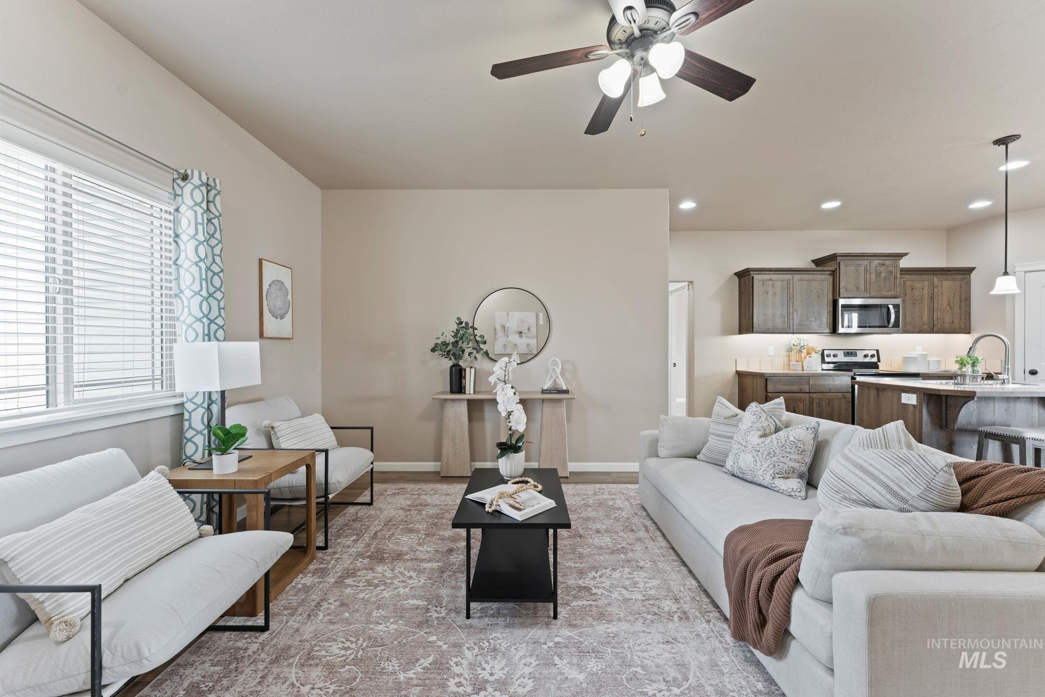 1001 13th Street Rupert, ID 83350 - Photo 4 of 40 Living room featuring ceiling fan, recessed lighting, and light wood finished floors
