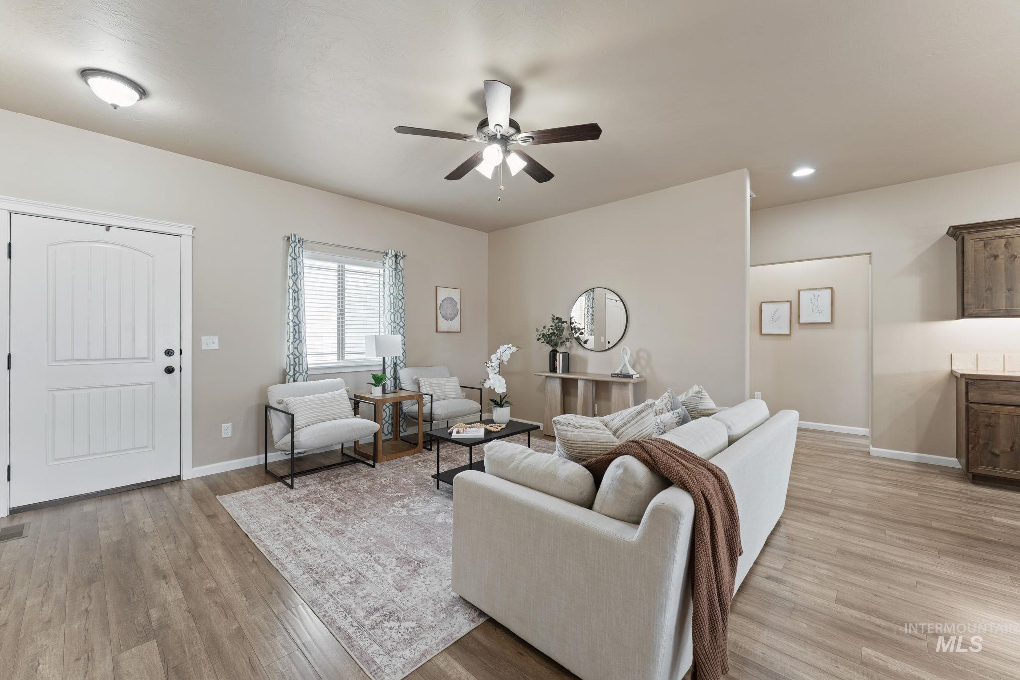 1001 13th Street Rupert, ID 83350 - Photo 5 of 40 Living room with ceiling fan, recessed lighting, and light wood-style floors
