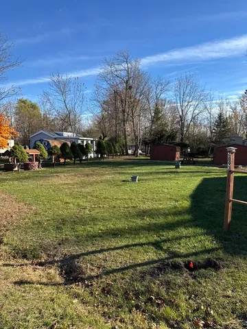 a view of a yard with an trees