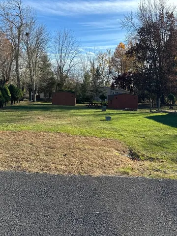 a backyard of a house with lots of green space