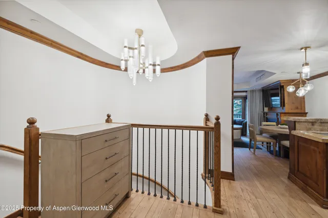 a view of a livingroom with furniture and hardwood floor