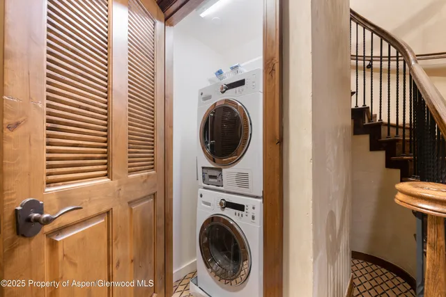 a view of a hallway with washer and dryer