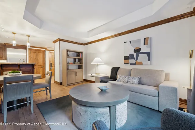 a living room with furniture and a table