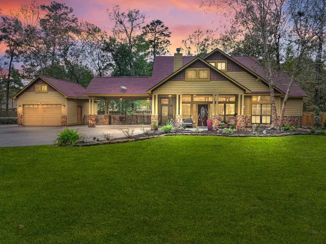 an aerial view of a city with lots of residential buildings and mountain view in back