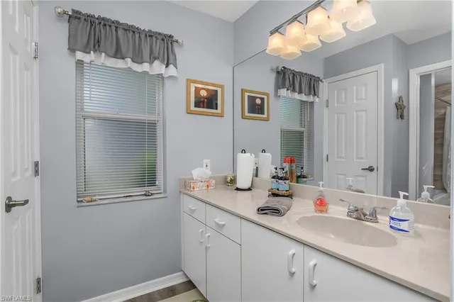 a bathroom with a sink double vanity and a mirror