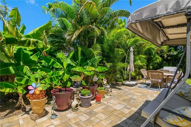 a view of a backyard with sitting area
