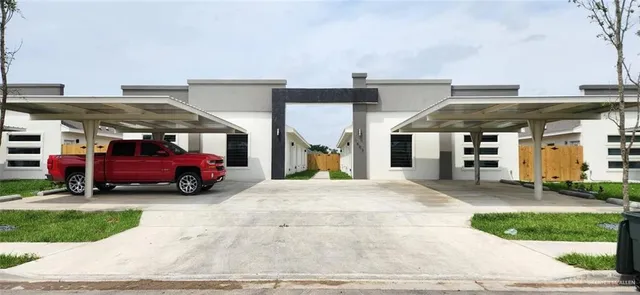 a view of a car is parked in front of a house