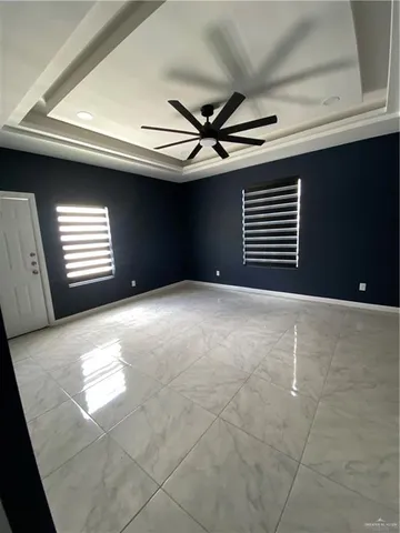 a view of empty room with windows