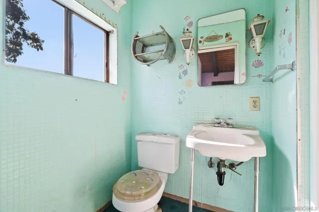 a bathroom with a mirror