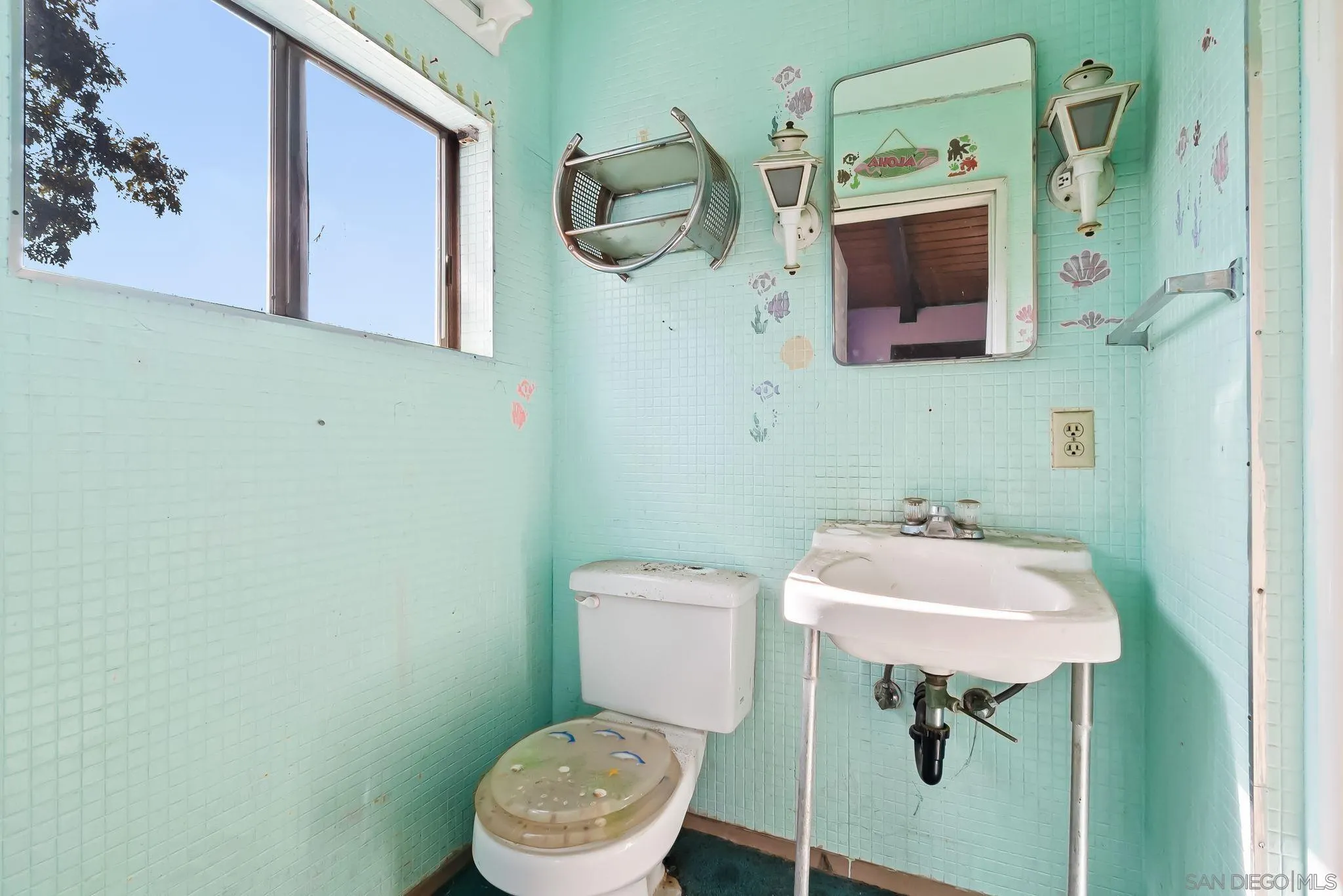 6133 Rainbow Heights Road Fallbrook, CA 92028 - Photo 14 of 55 a bathroom with a sink toilet and mirror