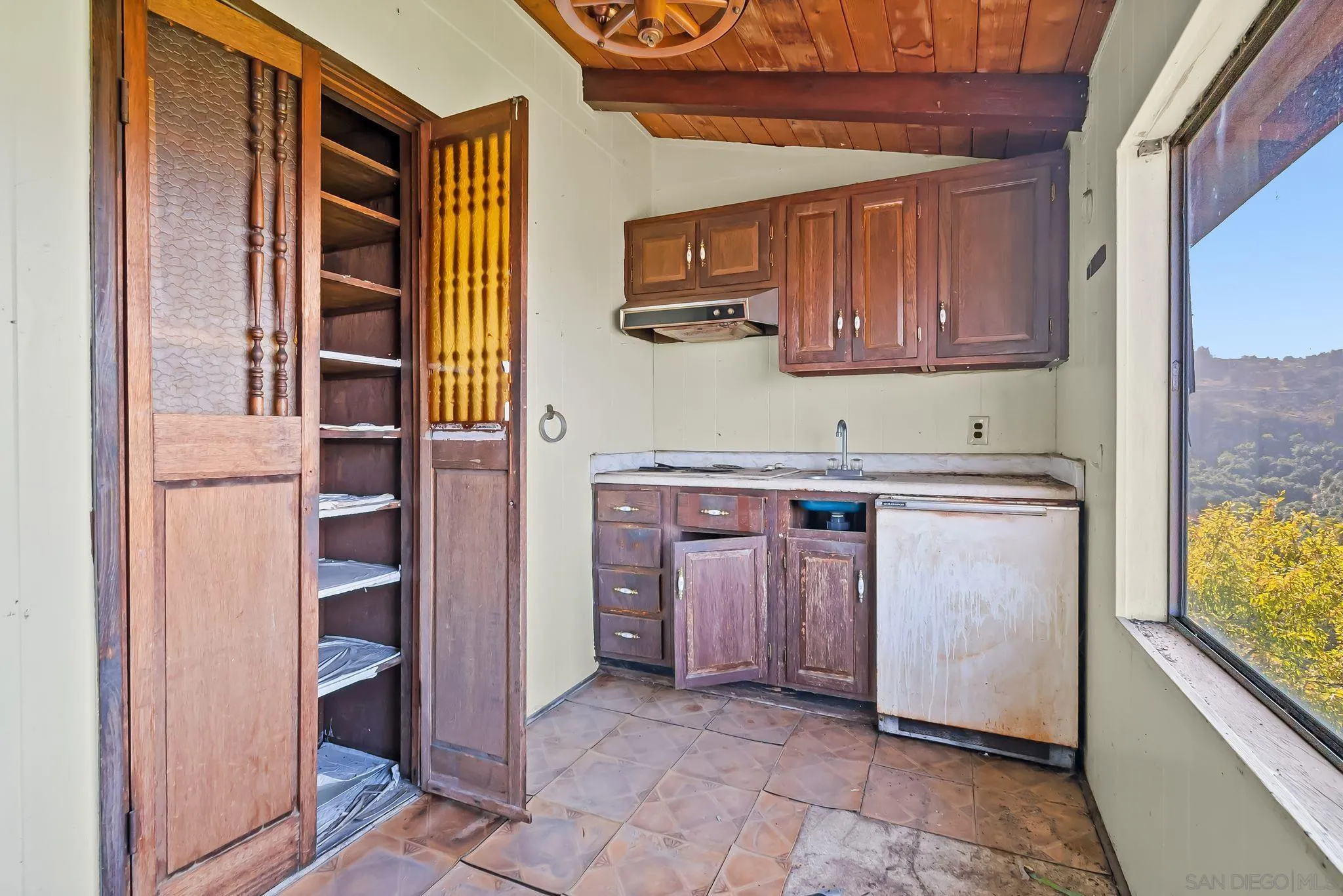 6133 Rainbow Heights Road Fallbrook, CA 92028 - Photo 16 of 55 a kitchen with a refrigerator and a sink