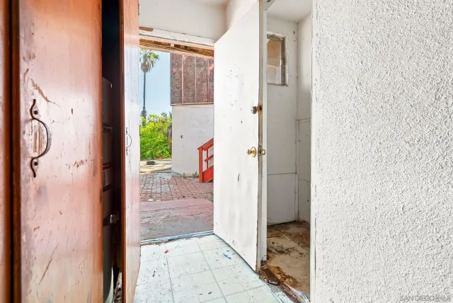a kitchen with stainless steel appliances a stove and a cabinets