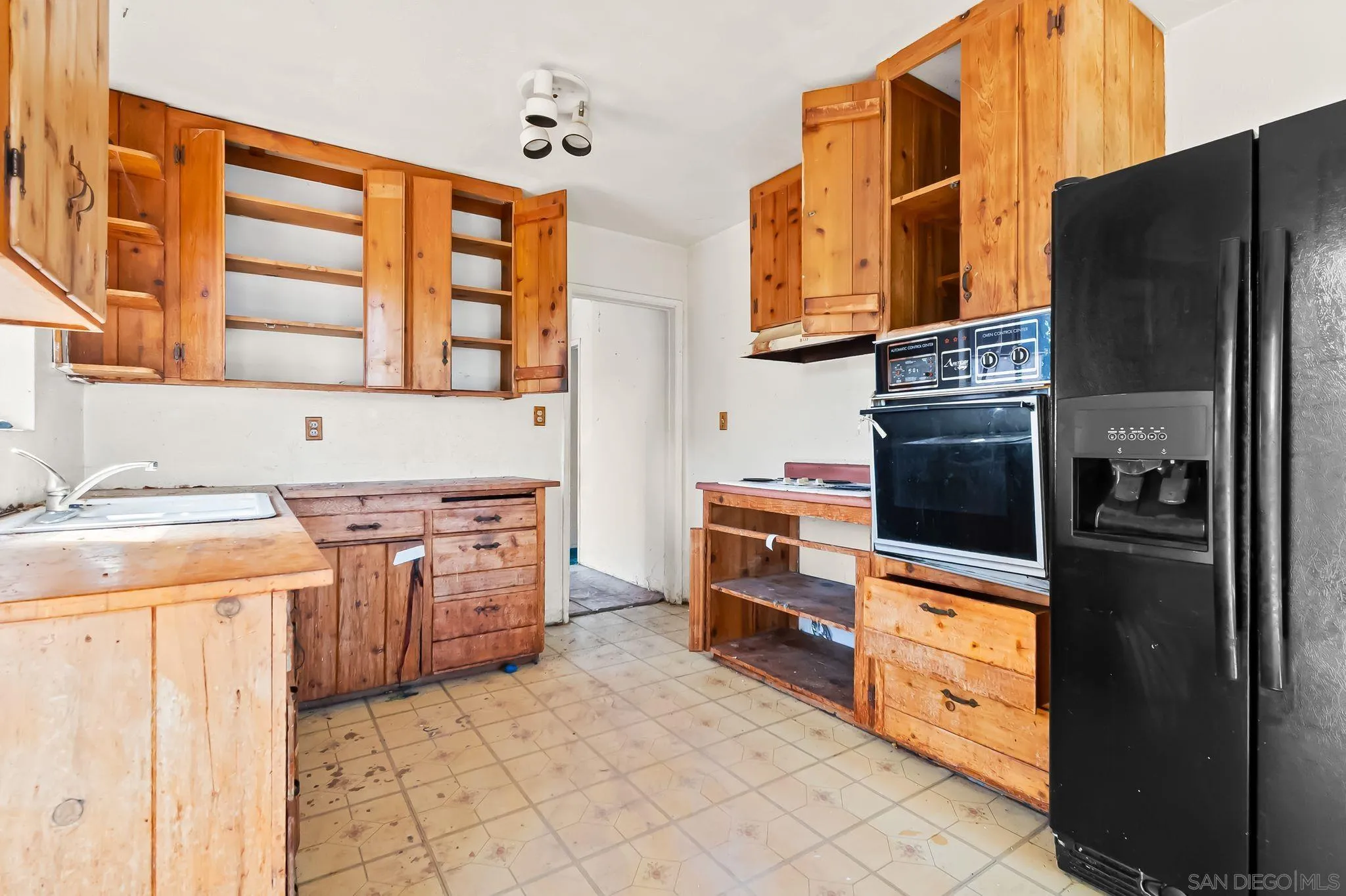 6133 Rainbow Heights Road Fallbrook, CA 92028 - Photo 26 of 55 a kitchen with stainless steel appliances granite countertop a refrigerator and a stove top oven