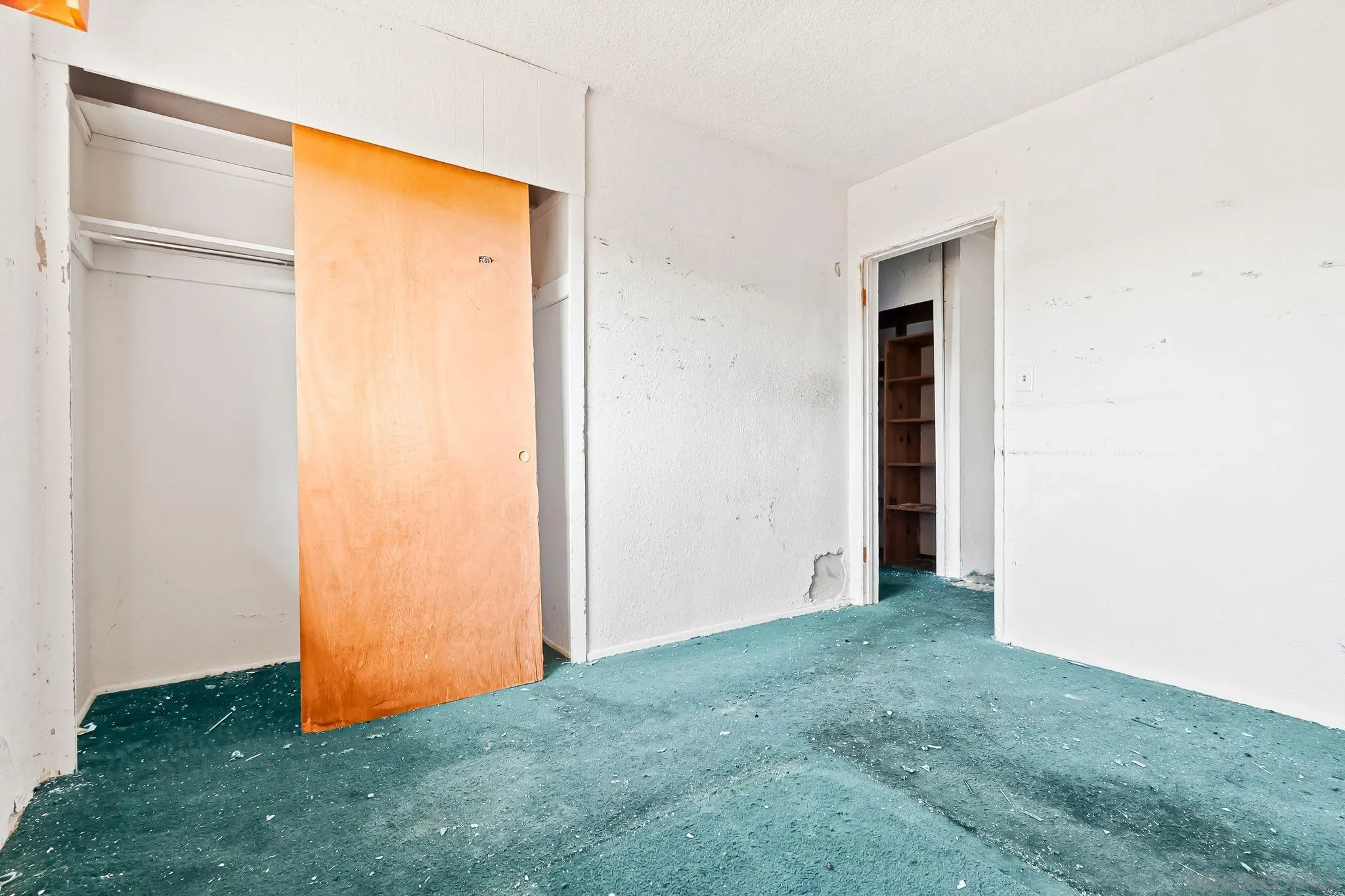 6133 Rainbow Heights Road Fallbrook, CA 92028 - Photo 39 of 55 a view of an empty room with closet and wooden floor