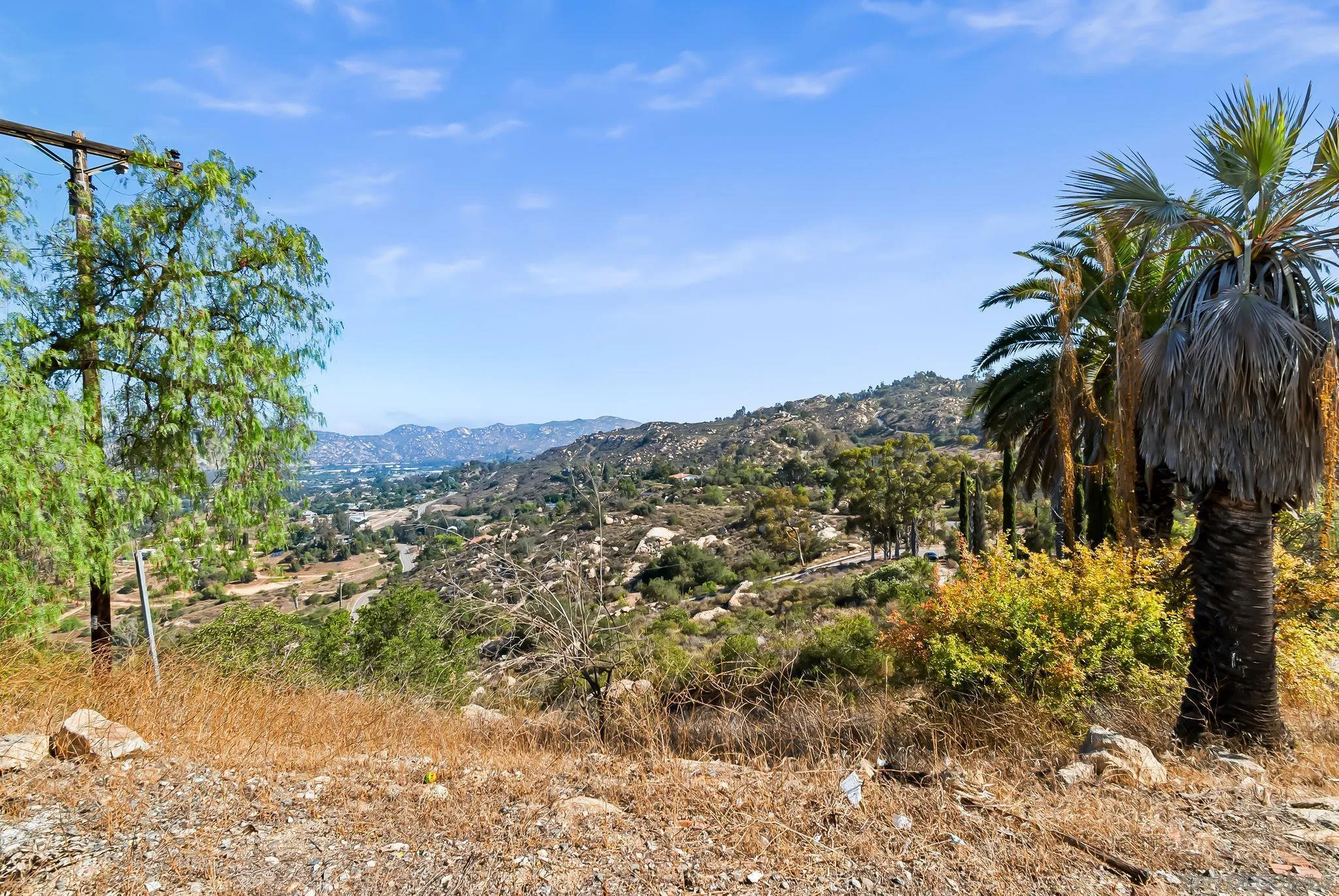 6133 Rainbow Heights Road Fallbrook, CA 92028 - Photo 44 of 55 a view of a lake with mountains in the background
