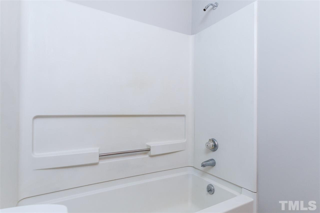 6705 Queen Annes Drive Raleigh, NC 27613 - Photo 2 of 3 a bathroom with a bathtub