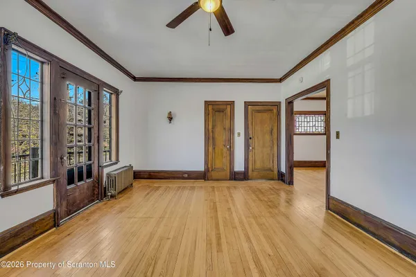 a view of an empty room with a window