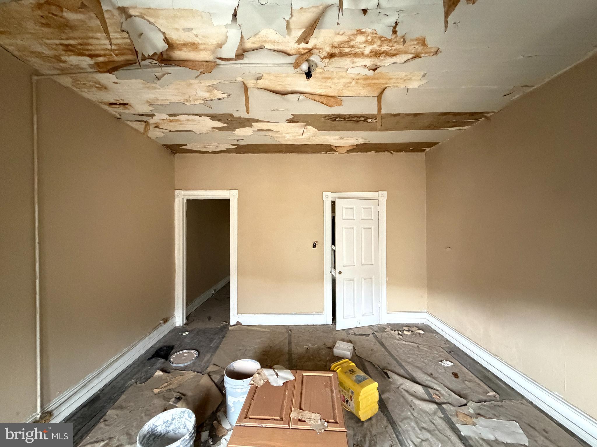 213 Furrow Street Baltimore, MD 21223 - Photo 13 of 19 a bedroom with a bed and a chandelier