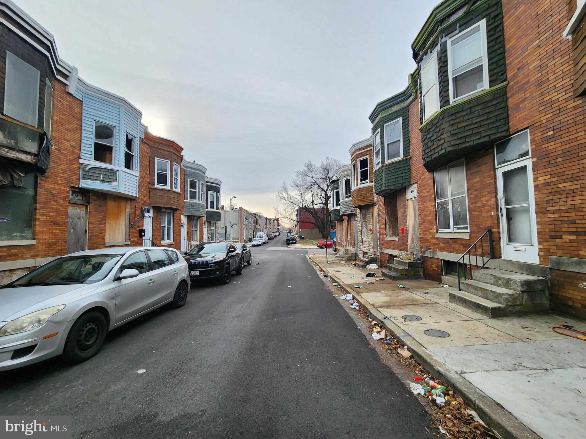 213 Furrow Street Baltimore, MD 21223 - Photo 17 of 19 a couple of cars parked in front of a building