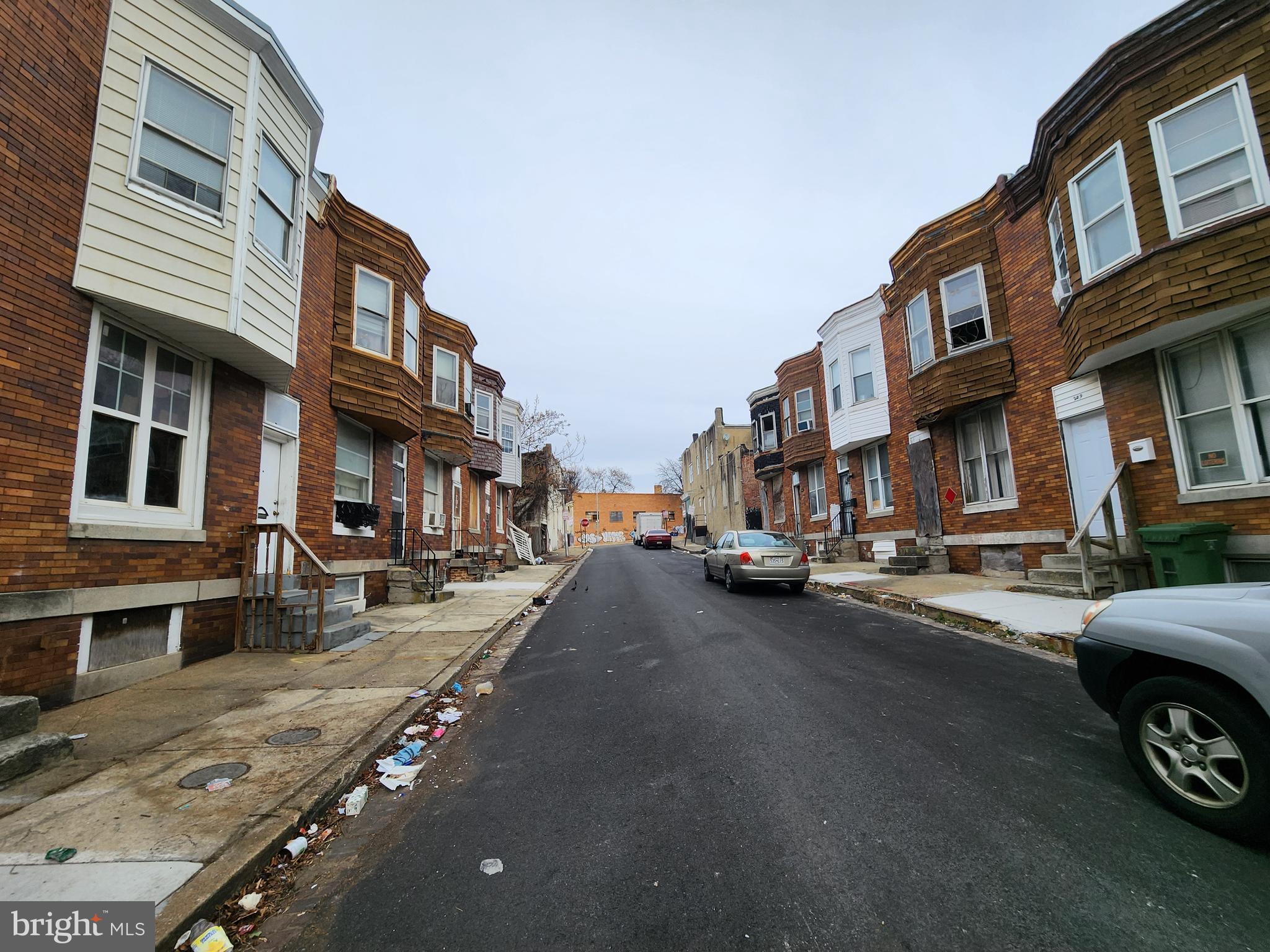 213 Furrow Street Baltimore, MD 21223 - Photo 18 of 19 a view of a street in a residential apartment building