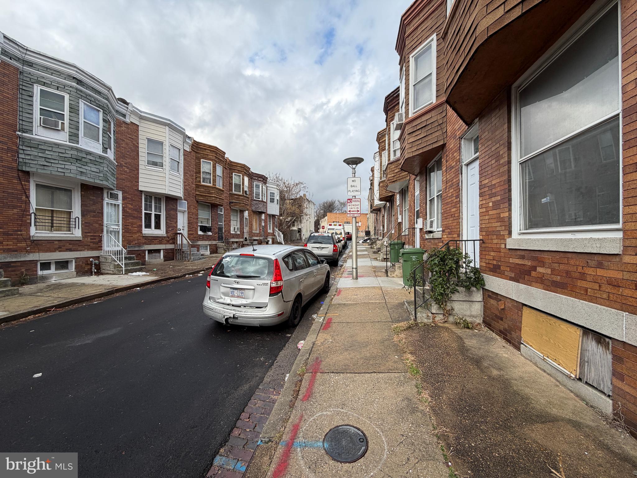 213 Furrow Street Baltimore, MD 21223 - Photo 19 of 19 a view of a street with cars