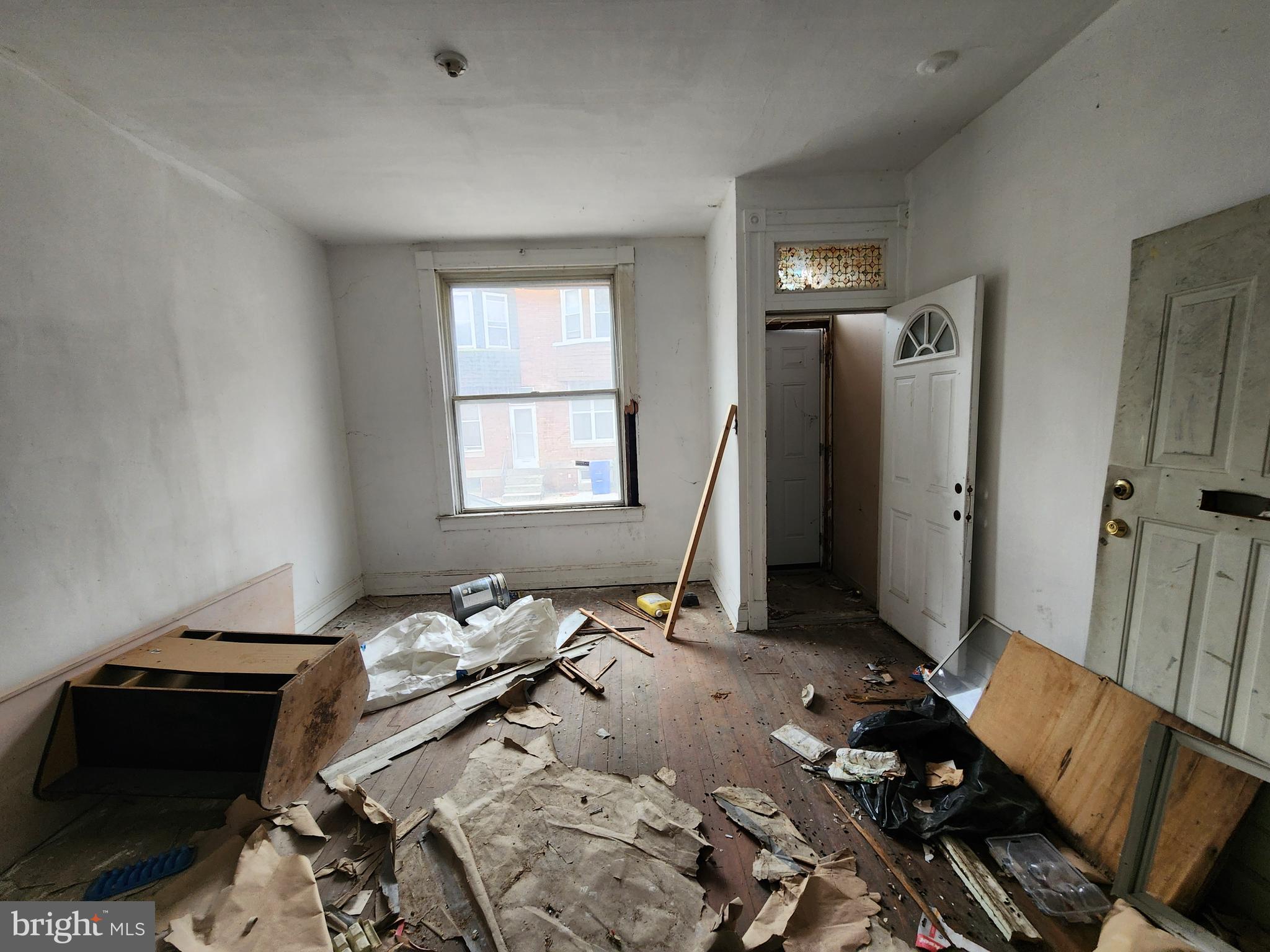 213 Furrow Street Baltimore, MD 21223 - Photo 4 of 19 a bedroom with a bed and a window