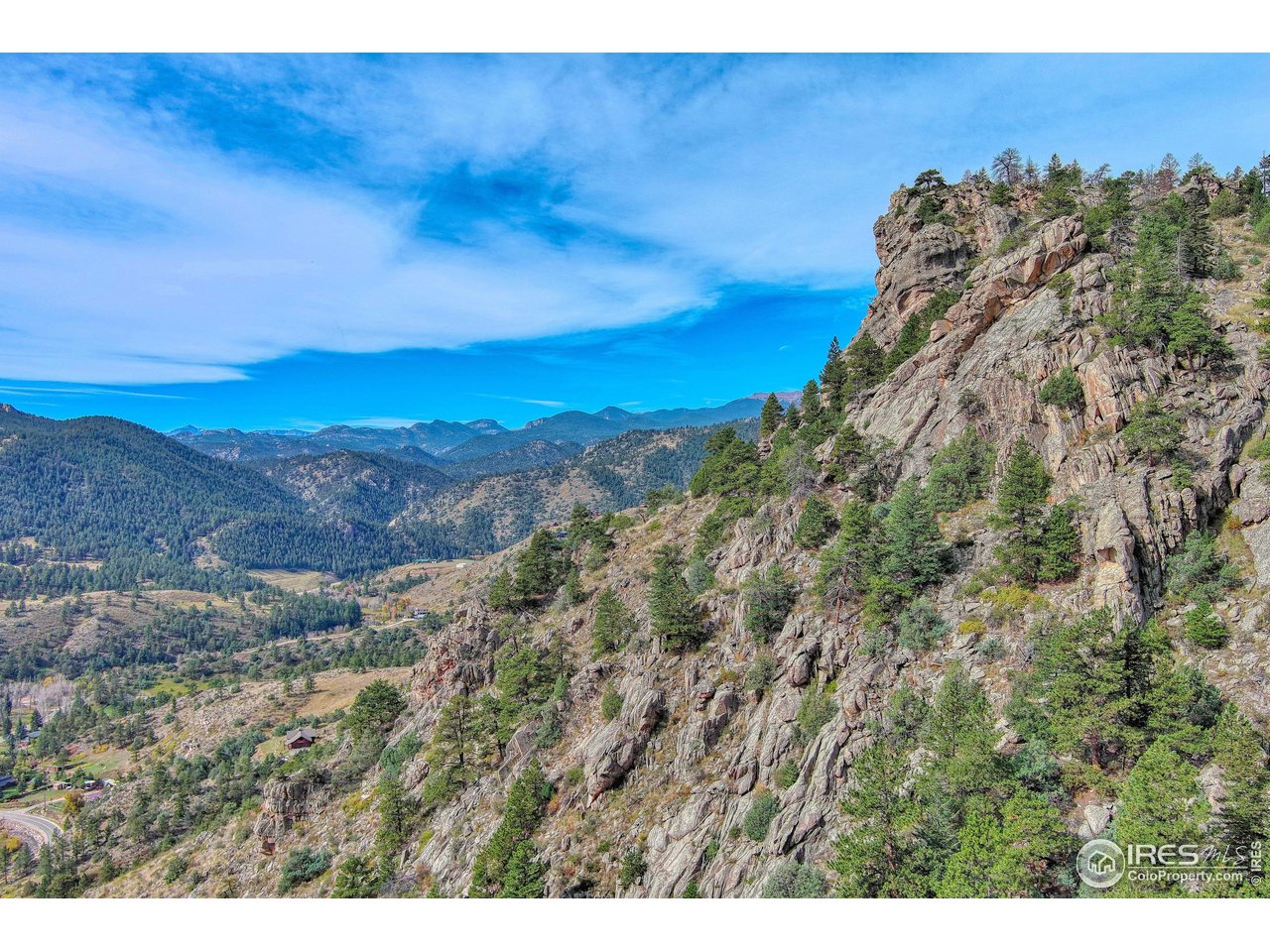 10697 County Road 43 Drake, CO 80515 - Photo 14 of 34 a view of a large building with mountains in the background