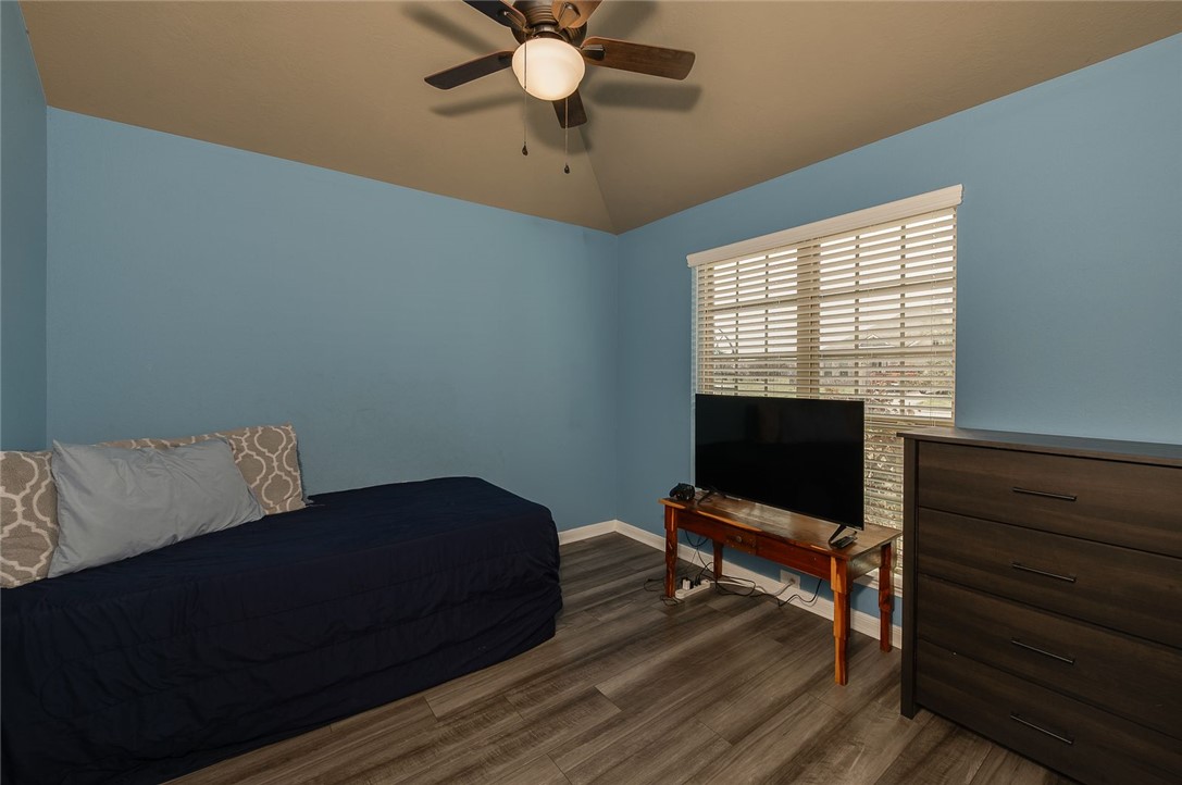 2702 Redcap Street Bryan, TX 77803 - Photo 13 of 17 a living room with furniture and a flat screen tv