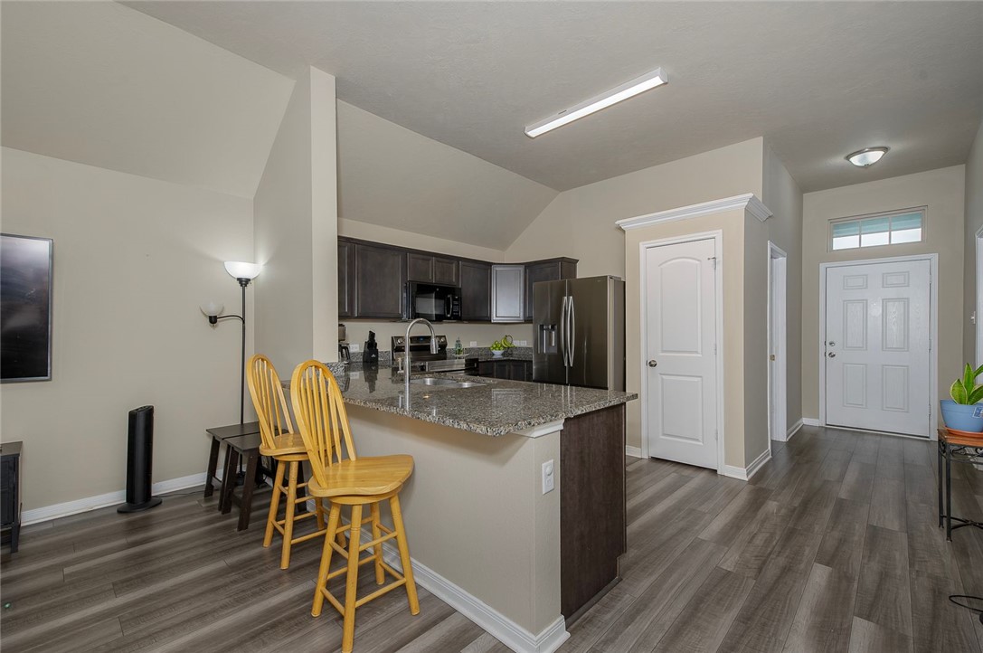 2702 Redcap Street Bryan, TX 77803 - Photo 5 of 17 a view of a dining room with furniture and wooden floor