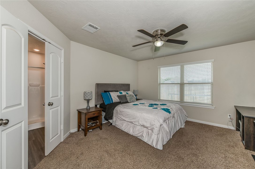 2702 Redcap Street Bryan, TX 77803 - Photo 7 of 17 a bedroom with a bed and a window