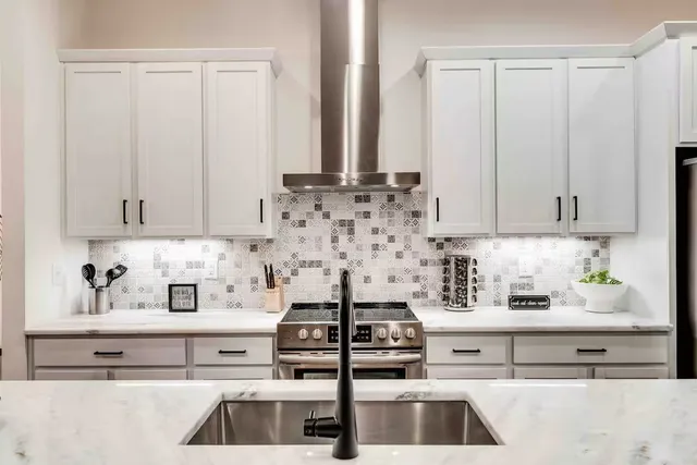 a kitchen with a stove and a sink