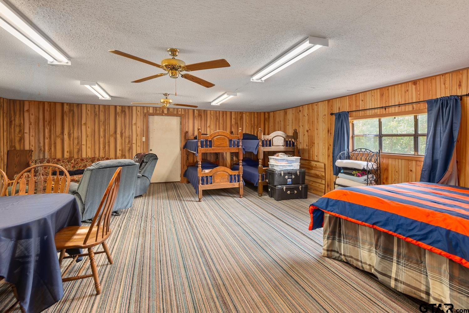 821 Gorman Oaks Road Big Sandy, TX 75755 - Photo 23 of 35 a bedroom with furniture window and wooden floor